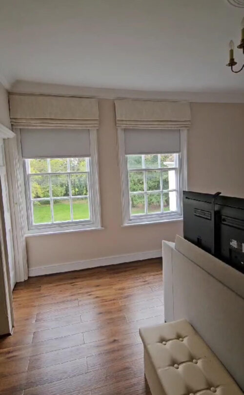 A Pair of Electric Blackout Roller Blinds with Cassetted Frame to give Blackout behind Roman Blinds in North London