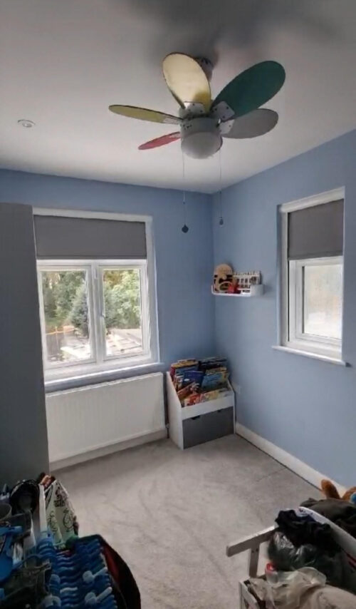 A pair of Fully Cassetted Total Blackout Roller Blinds for childs bedroom in London - simple but effective