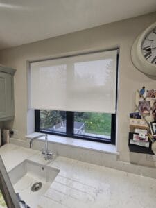 Kitchen window in Herts with electric motorised roller blind fitted before installation of Decorquip Capital Fascia