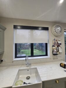 Kitchen window in Herts with electric motorised roller blind fitted and the installation of Decorquip Capital Fascia